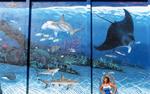 Cherie by a Wyland wall in the historic seaport district of Key West.