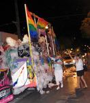 The 801 Bourbon St. float leaves a trail of bubbles down the street.