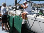 Helmsman Robbie Haines talks with "Genuine Risk" owner Randall Pittman before the race.  (Look at the size of those fenders!)