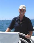 Cherie at the helm of "Pyewacket".  (I only drove after the race!)