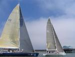 The yachts give the spectators on the pier something to talk about.