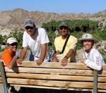 Lisa, Greg, Mark and Jean on a prehistoric bench.