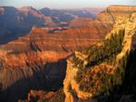 The Grand Canyon gets a bath in the crimson hues of sunset.