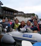 Piled into the dinghy, we watch the concert.