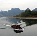 We watched nature’s landscape emerge through the mist on a boatride to Yangshuo.