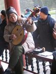 Meanwhile, musicians fill the air with Chinese melodies.