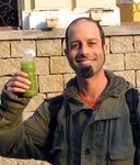 Scott holds up his drink--kiwi juice.