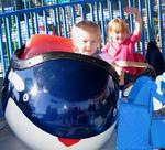 Sam and Ellie ride the little whales.