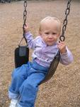 Sam finds that swinging on her own is safer than swinging with her dad.
