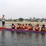 Coach Henry Kim stands at the bow with 7 years of dragon boat racing experience.