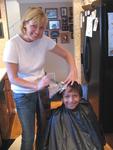 Tyler gets his hair done by Michelle.