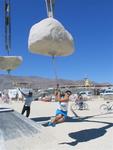 Karem swings on a giant rock.