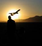 Greg and his plane at sunrise.