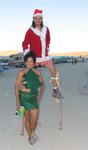 Santa on stilts.