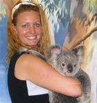 Cherie cuddles a Koala Bear in Cairns, Australia.  