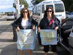 The twins show off their maps of Tassie.