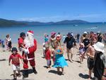 Families and children rush to greet Santa!