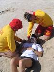 Diane asks if this is the first time the lifeguards have ever done this!  (Isn't that C-collar on backwards?)