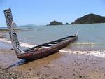 The Te Hoenga Waka (canoe) rests on the shore of Horotutu beach in Paihia. 