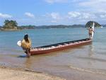Bringing the waka (canoe) to the tapu (sacred) island.