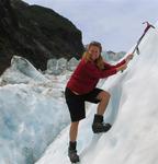 Cherie ice-climbing on the Franz Josef Glacier.  One of the fastest flowing and steepest glaciers in the world, Franz Joseph moves 10 times faster than other valley glaciers.