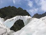 An arch of ice glistens in the sun.