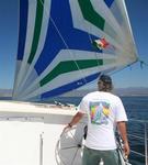 Richard at the helm. *Photo by Karen Vaccaro S/V Miela.