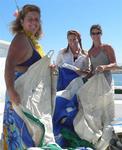 Spinnaker chicks: Anne, Cherie and Karen. *Photo by Rennie.