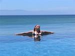 Cherie soaking up the sun in an infinity pool.