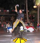 Greg saddles up to the mechanical bull.