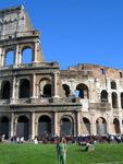 Cherie in front of the Coliseum in Rome. 