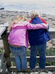 Brother and sister watch the elephant seals together.