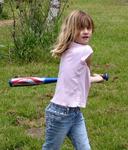 Ellie whacks the ball out of the campsite.