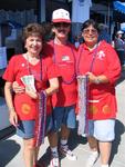 Paige Anderson and Al & Peaches Yarrington sell plastic bead necklaces to help raise money for veterans and troops.