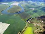 Meandering rivers and yellow canola fields.