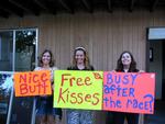 The girls are ready with their signs.