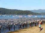 The peaceful lake is suddenly filled with the splash of almost 2000 Ironman triathletes.