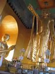 This is an image of Buddha pointing to the Royal Palace.  Buddha climbed Mandalay Hill, looked down, and proclaimed that a great city would be born below. 