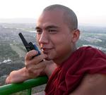 A monk on a walkie-talkie.