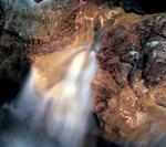 Pilgrims and local villagers come to the caves to bottle up the healing water and take it home to their elders.