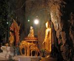 Out of respect for fellow Buddhists, visitors remove their shoes before entering the cave.