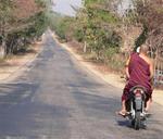 A monk on a motorcycle. *Photo by Jean Leitner.