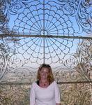 Cherie admires the intricate designs of the stairways leading to the top of Taung Kalat, a place where the Myanmar people worship both the Buddha and nats (spirts). *Photo by Jean Leitner.