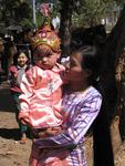 A woman with her little monk-to-be.