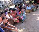 Ladies wait on the side of the road...only men can become Buddhas.