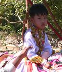 When a child chooses to become a monk, it is a great honor for a Myanmar family. *Photo by Jean Leitner.