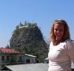 Cherie with the volcanic Taung Kalat in the distance. *Photo by Jean Leitner.