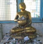 Offerings to the golden Buddha.