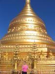 Jean flanked by a golden stupa.