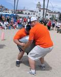 It takes two "big" volunteers to pick up the Heavy Weight sandbag.